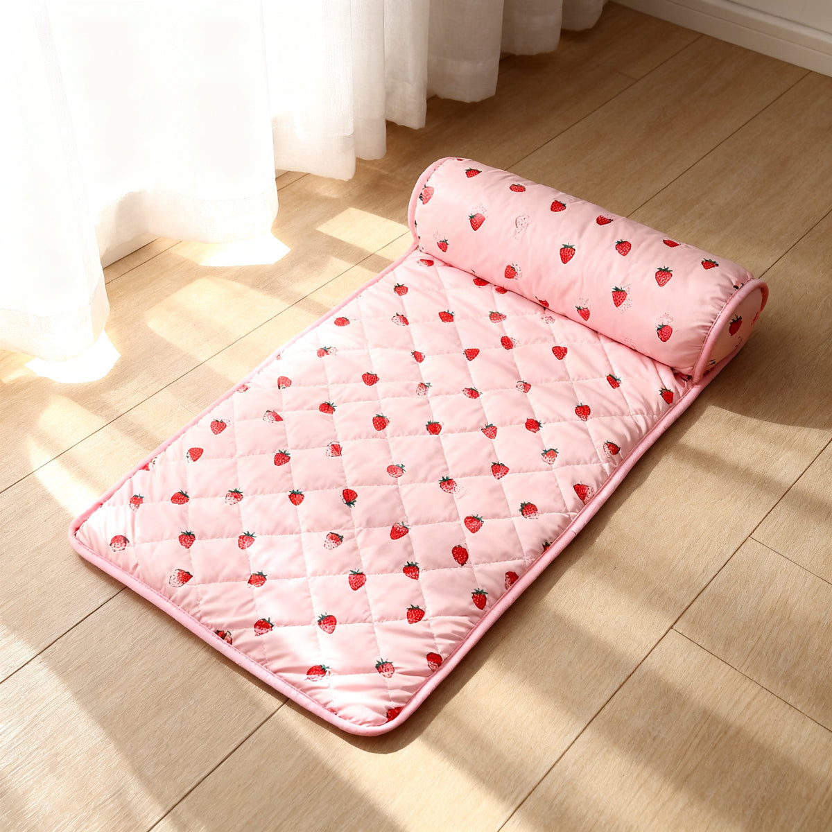 TrailPaw Ice Silk Bolster Pet Bed in the pink strawberry print, bolster pillow along one edge